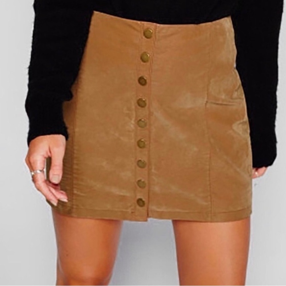 Free People Vegan leather snap front mini skirt new without tags.